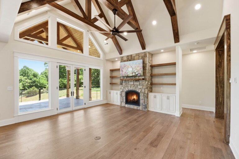 Knoxville custom home — floor-to-ceiling stone fireplace in the timber-beamed great room — Seigler Custom Homes