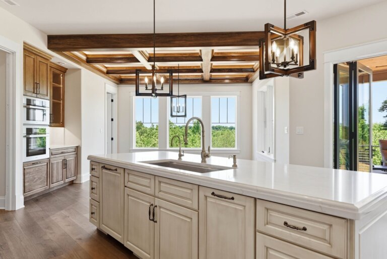 Knoxville custom home — gourmet kitchen with custom cabinetry, quartz island and coffered beam ceiling — Seigler Custom Homes